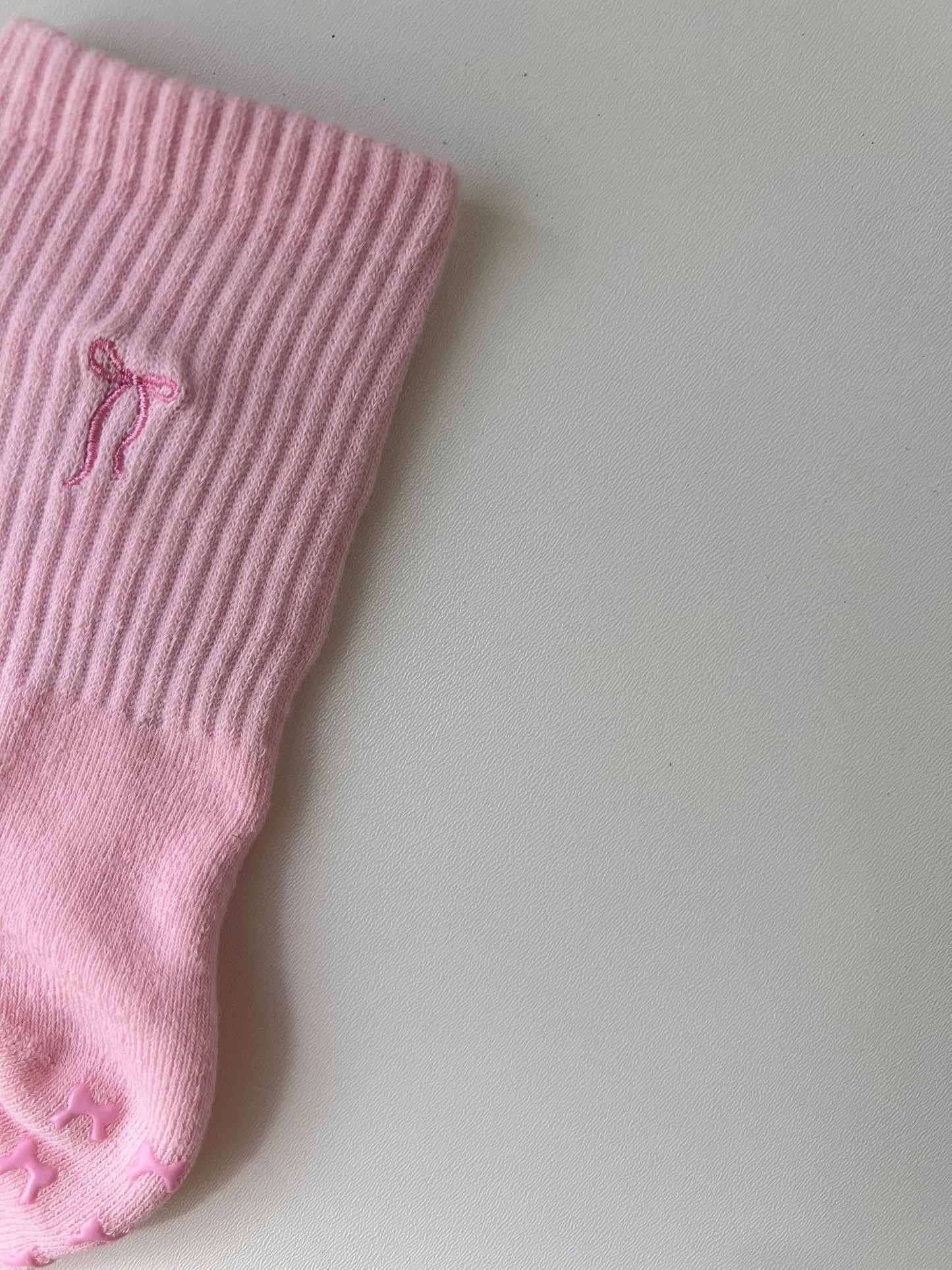 Pink bow grip socks